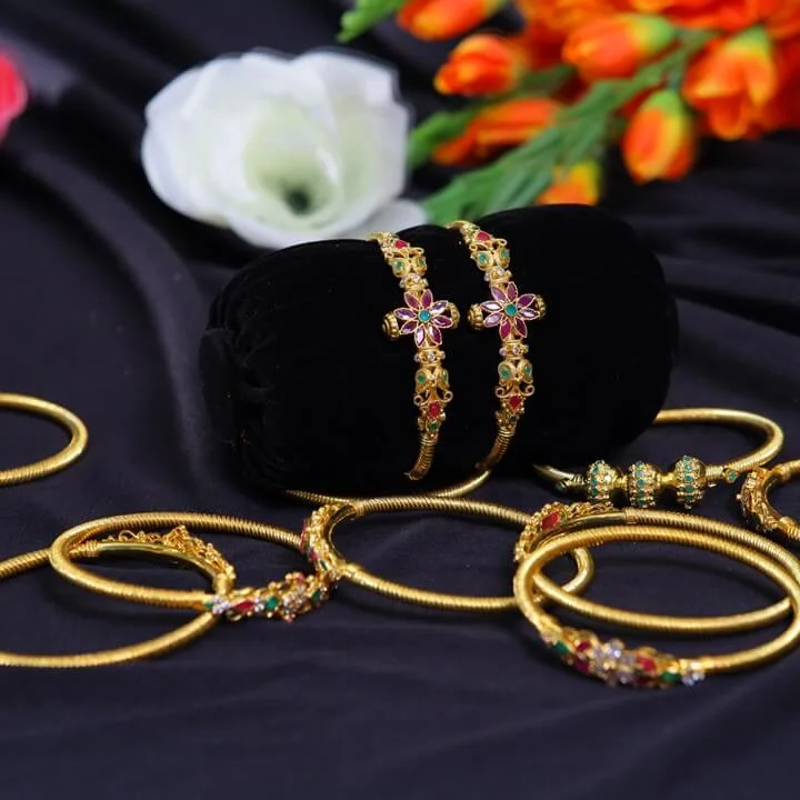  Light Weight Gold Plated Rigel Star Spring Bangles